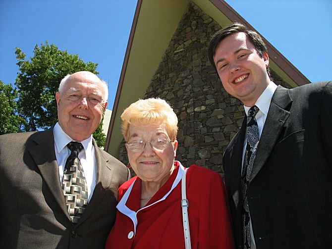 Grandfather, Grandmother, and Me in front of the Stake Center.