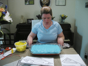 Krissy makes preparations for cake decorating